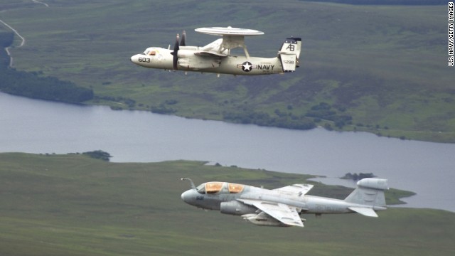 EA-6B Prowlers are among the U.S. aircraft that took off from the USS George H.W. Bush during recent attacks on ISIS. The Prowler is used to support attack aircraft by jamming enemy radar and communications and obtaining tactical intelligence. Here, a Prowler -- seen at bottom -- flies in formation with an E-2C Hawkeye in June 2004.