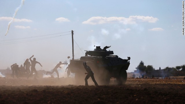 Turkish Kurds clash with Turkish security forces during a protest near Suruc on Monday, September 22. According to Time magazine, the protests were over Turkey's temporary decision to close the border with Syria.