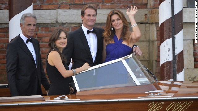 Cindy Crawford, right, and husband Rande Gerbe, center, board a taxi boat with other guests. 