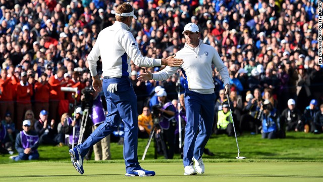 Europe's Rory McIlroy (right) and Ian Poulter claimed a vital half point against Jimmy Walker and Rickie Fowler in the morning fourballs on Saturday.