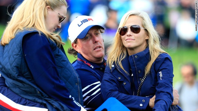 Phil Mickelson beat Stephen Gallacher in his final day singles but cuts a dejected figure as he sits alongside his wife Amy.