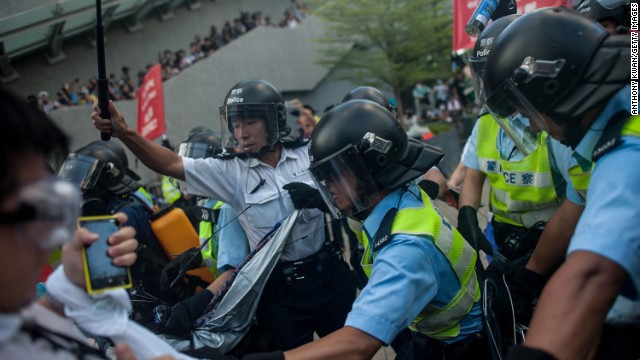 Riot police clash with protesters on September 28. 