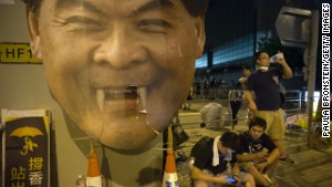 Groups of protesters gather outside the Hong Kong Government Complex in front of a poster mocking C.Y. Leung, Hong Kong\'s Chief Executive on September 30.