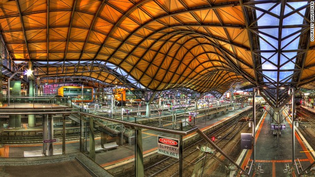 Originally built in 1859, Melbourne's Southern Cross Railway station was renovated in 2005 to include an undulating roof that covers an entire city block. At the western end of the station is a colorful "History of Transport" mural.