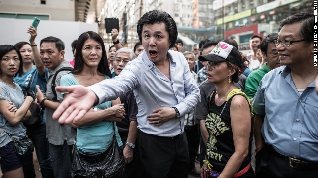 A man shouts at a pro-democracy demonstrator on October 3.