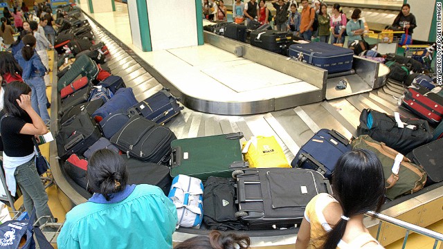 Would it hurt everyone to stand back from the luggage carousel a few feet? 