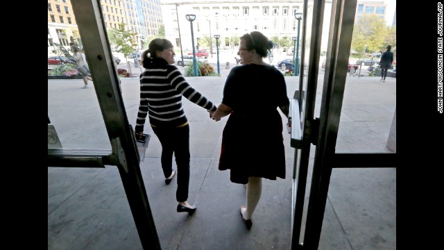 Abbi Huber, left, and Talia Frolkis exit the City County Building in Madison, Wisconsin, after applying for a marriage license on October 6.