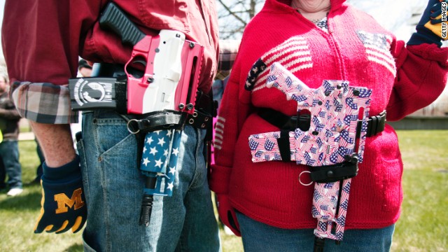  A couple at a Michigan open-carry gun rally celebrates America and the right to bear arms. Why is the U.S. the most armed nation on the planet? Some say you can't understand the country's gun culture without talking about race.