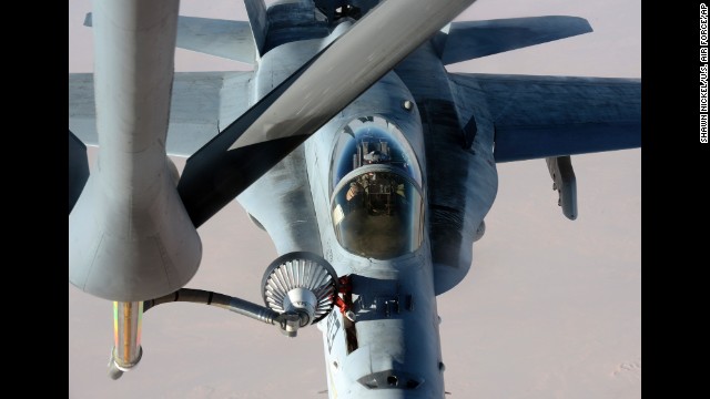 In this photo released by the U.S. Air Force on Saturday, October 4, a U.S. Navy jet is refueled in Iraqi airspace after conducting an airstrike against ISIS militants.