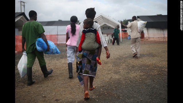Ebola survivors prepare to leave a Doctors Without Borders treatment center after recovering from the virus in Paynesville, Liberia, on October 12.