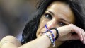 A football fan wipes a tear after Inter Milan's Argentinian defender Javier Zanetti has greeted fans following the announcement of his retirement before the start of the Italian seria A football match Inter Milan vs Lazio, on May 10, 2014, in San Siro Stadium In Milan