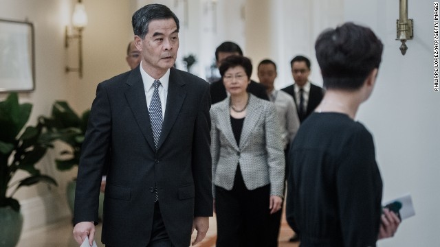 Hong Kong Chief Executive C.Y. Leung arrives for a news conference on October 16. He said talks would resume with students as early as next week, but he said street protests had caused severe disruption and could not continue.