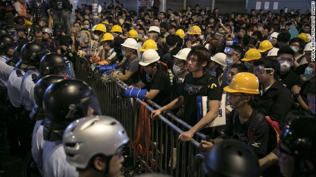 Police and protesters face each other across a barricade as tensions continue in Hong Kong on Monday, October 20.