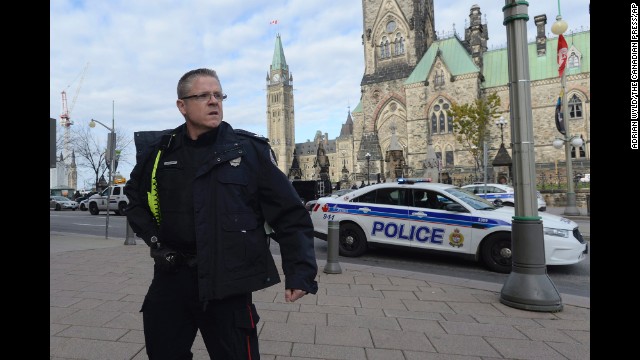 A police officer secures the scene.