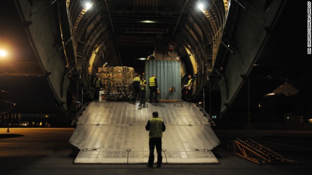 Crew members at an airport in Accra, Ghana, unload supplies sent from China on Wednesday, October 29.