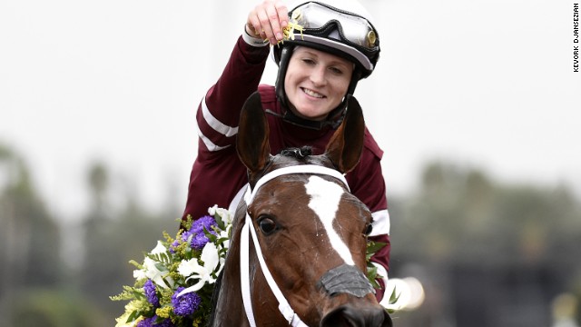 Rosie Napravnik celebrates atop Untapable after becoming the first female jockey to win the Breeders' Cup Distaff in Santa Anita, California. Napravnik would later announce she was retiring because she is seven weeks pregnant.