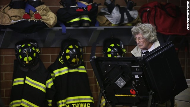 A voter casts her ballot at a fire station in Climax, North Carolina.
