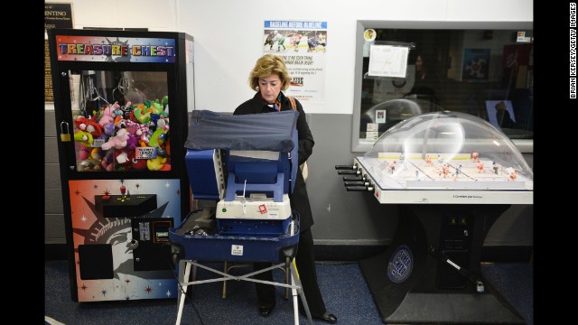A woman votes at the Oakton Ice Arena in Park Ridge, Illinois.
