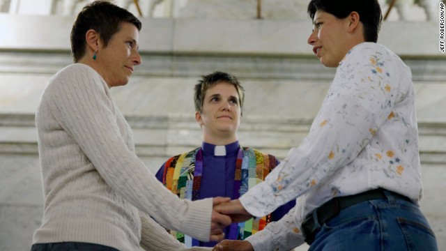 April Dawn Breeden, left, and longtime partner Crystal Peairs are married by the Rev. Katie Hotze-Wilton at St. Louis City Hall on Wednesday, November 5. A Missouri judge on November 5 overturned the state's ban on same-sex marriages and ordered registrars to start issuing licenses to gay and lesbian couples. More than 30 states and the District of Columbia allow marriage for same-sex couples.