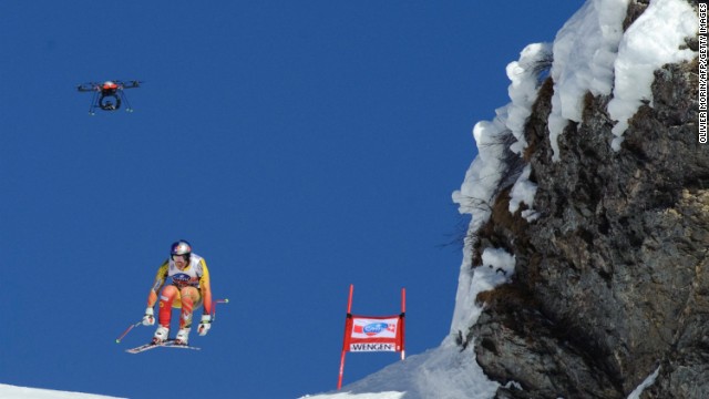 Drones soon became features of major sports events. Here, Canada's Erik Guay competes beneath a drone during an Alpine skiing World Cup downhill race in early 2012.