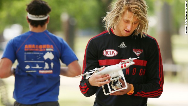 Drones are a part of training sessions now, too. Aussie Rules player Dyson Heppell babysits one while training with the AFL's Essendon Bombers in November 2014.