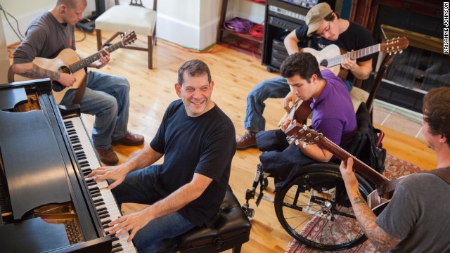 MusiCorps pairs professional musicians with recovering troops, helping them play instruments and write and record music.