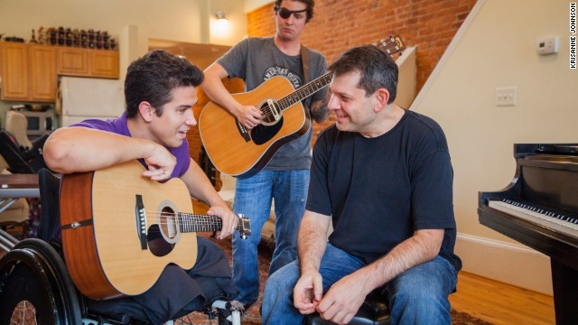 Arthur Bloom, right, rehearses with members of the MusiCorps Wounded Warrior Band at Bloom's home in Washington. Through his nonprofit, Bloom is using music to help hundreds of injured troops recover their lives.