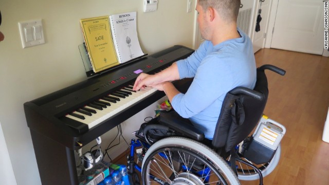 MusiCorps participant Greg Galeazzi practices at his home in Washington. "Music has always been important to me," he said. "I felt a deep sadness because I thought I'd lost my ability to play music."