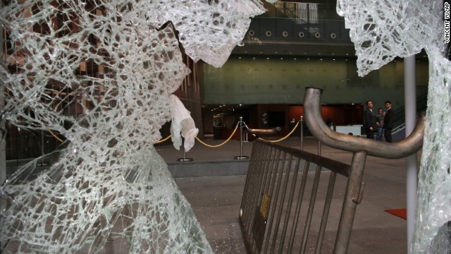 Broken glass is seen after protesters attempted to break into the Legislative Council building in Hong Kong on November 19. Pro-democracy demonstrators are angry about China's decision to allow only Beijing-vetted candidates to run in Hong Kong's elections for chief executive in 2017.