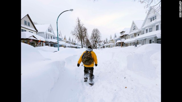 A man walks in his Buffalo neighborhood on Thursday, November 20.