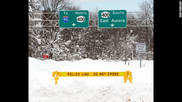 A police barrier prevents vehicles from entering Route 400 in West Seneca, New York, on November 20.