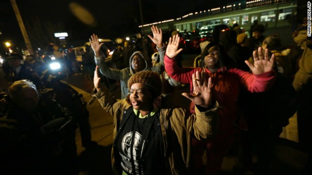 Protesters gather as they wait for the announcement of the grand jury decision on November 24.