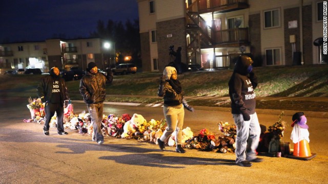 Residents begin to gather at the Michael Brown memorial ahead of the grand jury announcement.