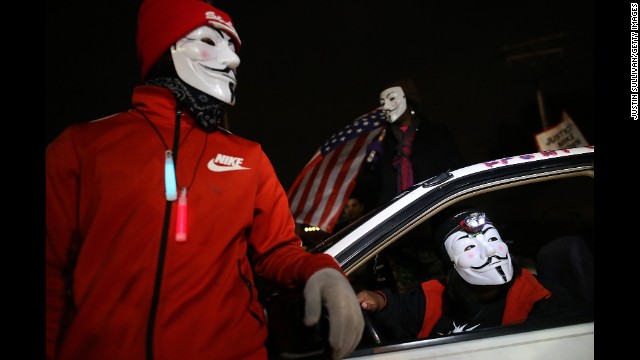 Demonstrators block traffic during a protest in front of the Ferguson Police Department on November 24.