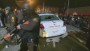 Ferguson protesters smash police car