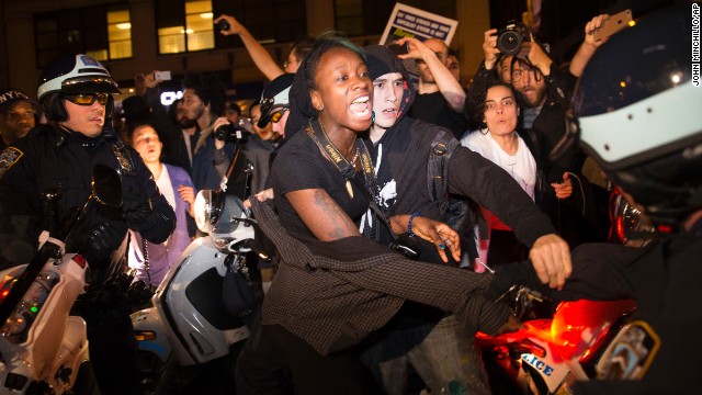 A protester in New York scuffles with police during a march toward Times Square on November 24.