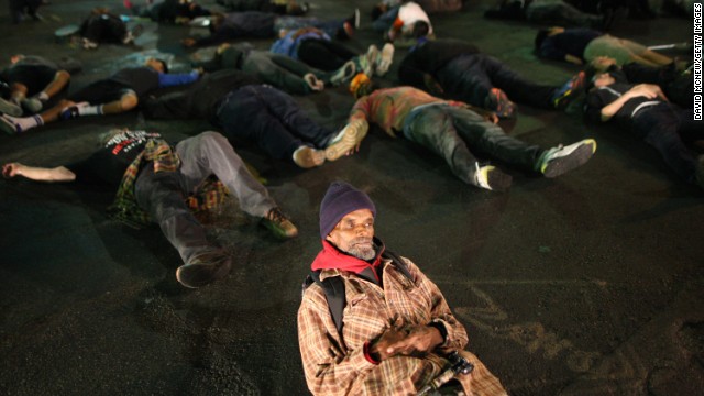 Protesters in Los Angeles lie down in a major intersection to block traffic on November 24.