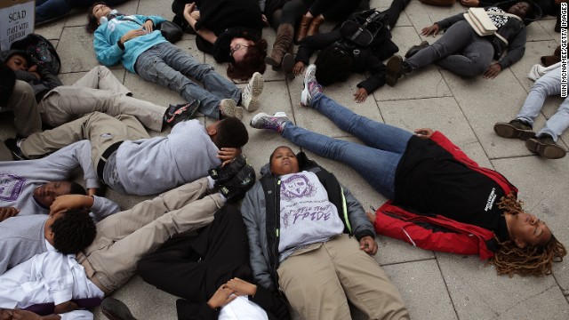 Schoolchildren from the Potomac Preparatory Charter School take part in a "die-in" November 25 during a protest outside the Office of Police Complaints in Washington.