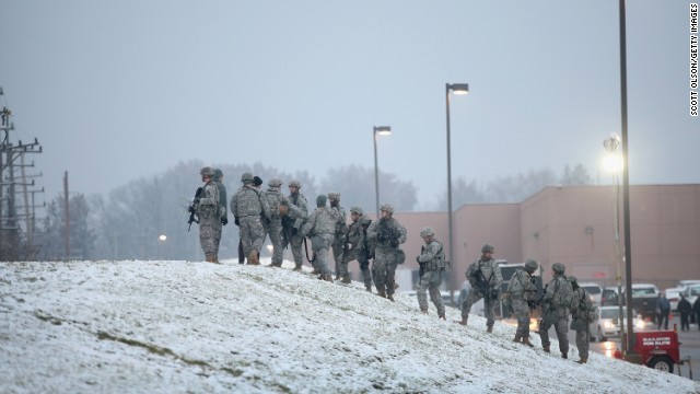 National Guard troops, who were called up by Gov. Jay Nixon to help maintain order, help with security at the mall on Wednesday, November 26.