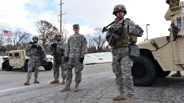 Members of the National Guard man a checkpoint at a Ferguson shopping mall on November 27.