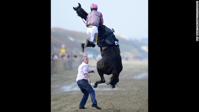 Jockey Johnny King goes flying Thursday, September 4, after mounting Arbitrageur at Laytown Racecourse in Laytown, Ireland. Both the horse and jockey were OK, and they went on to finish in seventh in their race.