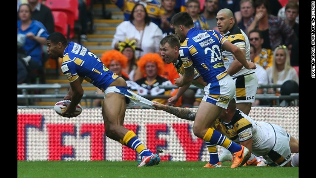 Kallum Watkins of the Leeds Rhinos has his shorts pulled down during the Challenge Cup final, which was played Saturday, August 23, in London. Leeds defeated the Castleford Tigers 23-10.