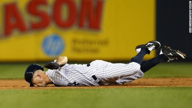 Brett Gardner of the New York Yankees dives into second base as he tries to get a double Wednesday, September 3, in a home game against the Boston Red Sox. He was tagged out on the play.
