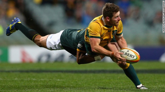 Australia's Bernard Foley is tackled by a South African player during a Rugby Championship match in Perth, Australia, on Saturday, September 6. Australia defeated South Africa 24-23.