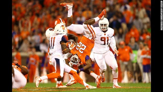 Clemson running back D.J. Howard flips in the air after being hit by a Syracuse player Saturday, October 25, in Clemson, South Carolina.