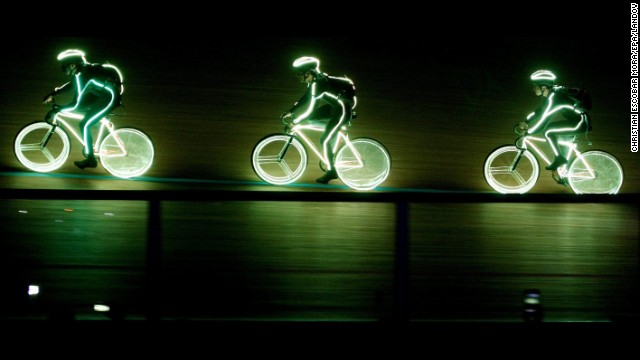 Cyclists with neon costumes participate in the opening of the Track Cycling World Championships in Cali, Colombia, on Wednesday, February 26.