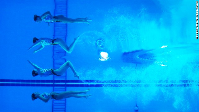 The reflections of Yukiko Inui and Risako Mitsui, two synchronized swimmers from Japan, are seen underwater as they perform at the Asian Games in Incheon, South Korea, on Saturday, September 20. They won silver in the duets event.