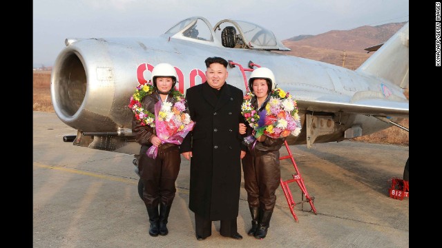 In an undated photo released on November 28, North Korea leader Kim Jong Un is seen on a field trip to see the airwomen of the KPA Air and Anti-Air Force. North Korean Newspaper Rodong Sinmun reported Kim "guided a flight drill of pursuit airwomen of the KPA Air and Anti-Air Force. He went out to an airport's runway to learn about the plan for solo take-off and landing drill by women pilots of pursuit planes and guide their flight."