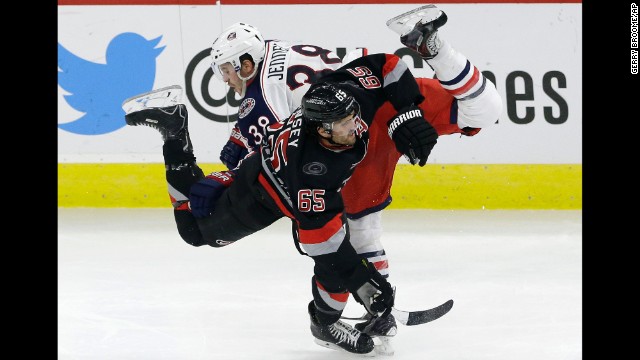 Ron Hainsey of the Carolina Hurricanes and Boone Jenner of the Columbus Blue Jackets collide during a game in Raleigh, North Carolina, on Friday, November 7.