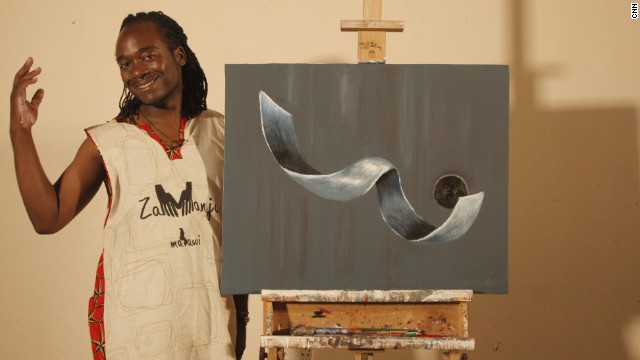 Kambalu stands next to his piece "Fallen Angel" painted exclusively for CNN. Describing it afterwards, he says: "When I was told that at the very end I would paint for the cameras, I wanted to present to the world a kind of work that was fresh and quite new to the eye. I must confess that though I had an idea of what I needed to paint the colors were instantaneous. I found myself going for the violets, grays, whites, with some shock of pithalo blues. Fallen Angel is a depiction of space and movement, and it borders on fantasy." 